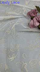 Encaje de tul francés con hilo bordado, malla ultrafina para una elegancia transparente con brillo sutil