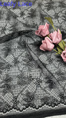 Tela de encaje bordado negro con flores caladas y lentejuelas láser para vestidos de fiesta y ropa