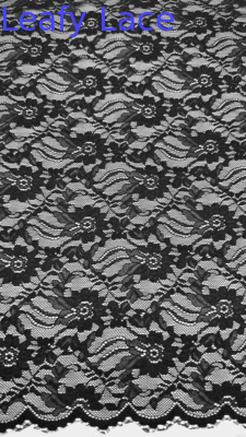 Tejido de encaje de estiramiento de ancho completo en negro elegantes patrones florales y bordes encapuchados para vestidos de mujeres de moda