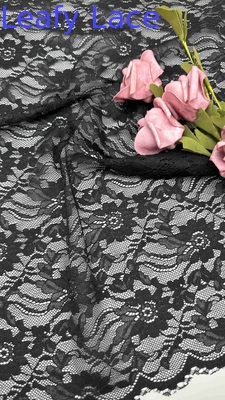 Tejido de encaje de estiramiento de ancho completo en negro elegantes patrones florales y bordes encapuchados para vestidos de mujeres de moda