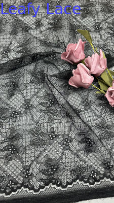 Tela de encaje bordado negro con flores caladas y lentejuelas láser para vestidos de fiesta y ropa