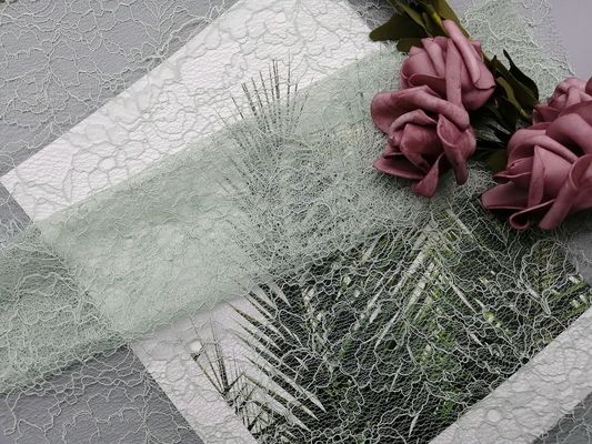 La tela atada 100% del cordón del poliéster modificó la tela bordada del color para requisitos particulares